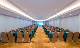 a conference room with rows of chairs arranged in a semicircle , ready for a meeting or event at Vienna Hotel