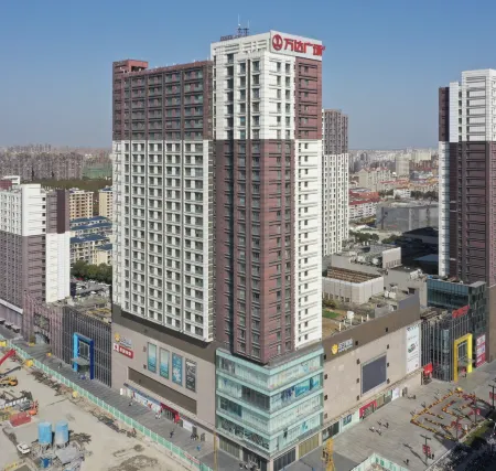 Suju Service Apartment (Shanghai International Tourism and Resorts Zone Zhoupu Wanda) Отели рядом с достопримечательностью «Shanghai Customs College»