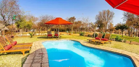 Tshikwalo Game Lodge Отели в г. Куллинан