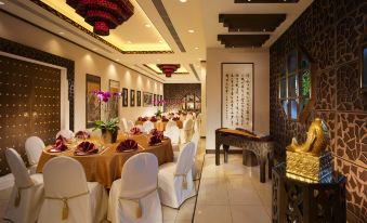 The restaurant offers a spacious and elegant setting with tables and chairs, ideal for hosting business luncheons or formal dining at Harbour Plaza Resort City