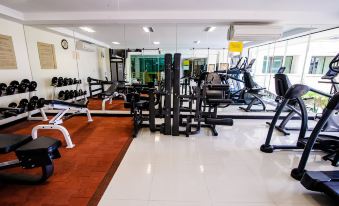 a well - equipped gym with a variety of exercise equipment , including treadmills , weight machines , and benches at Kacha Resort & Spa, Koh Chang