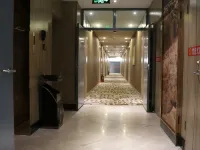 โรงแรมโฮมอินน์ รุ่ยบายยูน ยุน (สถานีรถไฟถนนซินเถียน ฮูมา) โรงแรมในฮูมา