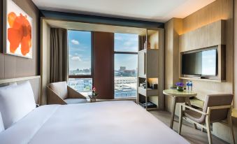 windows, is available for guests to enjoy the nighttime cityscape at Novotel Shanghai Clover