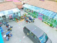 Shili Chunfeng Youcaihua Inn - parkir