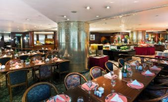 The restaurant has a central dining room with tables and chairs for business luncheons at The Kimberley Hotel