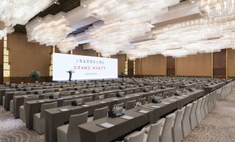 A spacious room is arranged with rows of tables for an event or conference at Grand Hyatt Shanghai