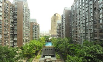 Muzijia Apartment (Xishuangbanna Jinghong Splashing Water Plaza)