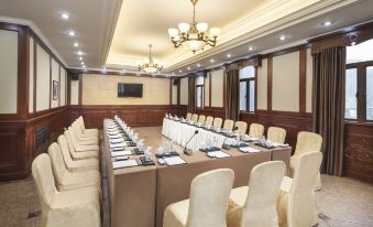 The hotel offers a spacious meeting room with long tables and chairs for various functions at Pacific Hotel