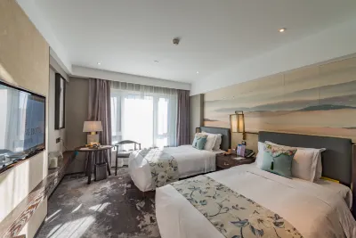 Rezen Dong Hotel (Harbin West Railway Station, Wanda Plaza) Отели рядом с достопримечательностью «Dongqing Stadium»