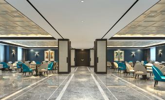 The lobby or dining room features a modern restaurant with large windows and floor-to-ceiling glass at Zhedong Chuyue International Hotel