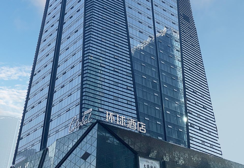 The building where the hotel is situated has blue and white colors on its top at Global Hotel