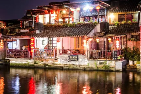 Four Seasons Spring Inn (Xitang Linhe store) Отели рядом с достопримечательностью «Yongning Bridge»