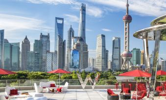 The rooftop offers a panoramic view of skyscrapers and other buildings in the urban area at W Shanghai - The Bund