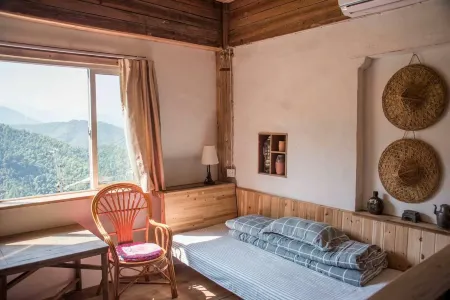 Xiuning Muli Hong Rhododendron Inn Отели рядом с достопримечательностью «Zuyuancun»