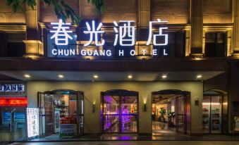"At night, there is a restaurant entrance with a sign that says ""hotel"" above it" at Chunguang Hotel