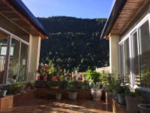Mingcai Hotel (Siguniangshan Scenic Area)