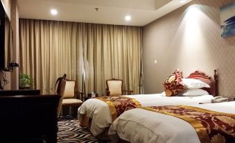 The bedroom features two beds and an adjoining sitting area with chairs by the window at Shangtex Hotel