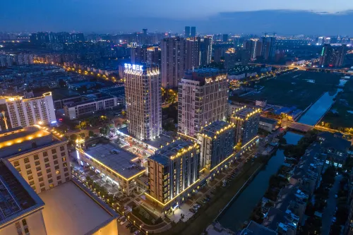 Maoyuan Qiluo Pushi Apartment Hotel - Condos