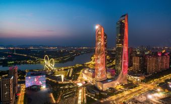 cityscape at night with buildings illuminated at International Youth Convention Hotel (Nanjing International Youth Cultural Centre)