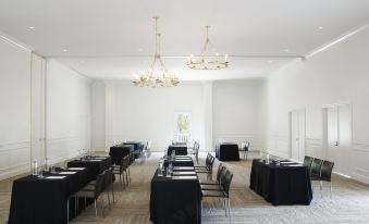 a large conference room with multiple tables and chairs set up for a meeting or event at Isla Bella Beach Resort & Spa - Florida Keys