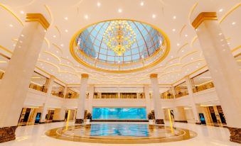 The lobby and main room of a spacious building feature a grand arched ceiling at Guoce International Conference and Exhibition Center