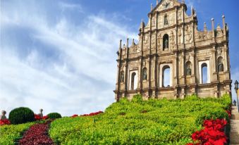 The city is adorned with a cathedral in the front and a neighboring building on one side at Rio Hotel