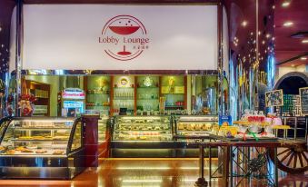 The restaurant features a wide variety of food options displayed on the counter, including an ice cream shop located at the front at The Great Wall Hotel Beijing