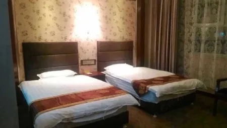 Qitai Delong Business Hotel Отели рядом с достопримечательностью «Ancient City Gymnasium»