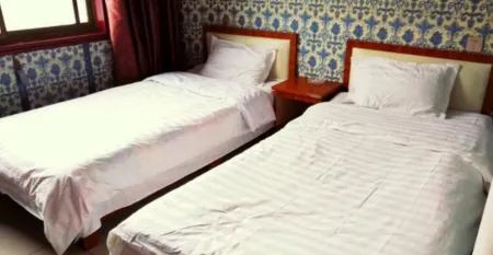 Huixian Zhongyi Inn Отели в г. Хуэйсянь