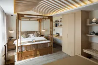 Xiuwenlongchangyi Hotel فنادق في شيو ون