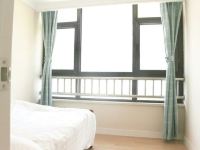 四叶草海景度假公寓(青岛万达东方影都店) - 豪华海景双卧套房