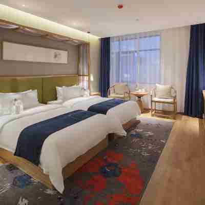 仟那酒店(新鄉華蘭大道胖東來購物廣場店) Rooms