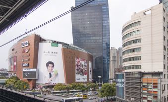 The city is characterized by its numerous tall buildings on both sides of the street at Yunrui Hotel, Zhongshan Park, Shanghai