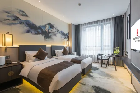 Rezen Dong Hotel (Control Memorial Tower Central Street Branch) Отели рядом с достопримечательностью «Ha'erbin Shangye University»