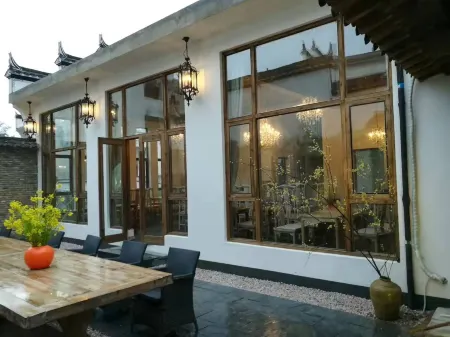 Nanxiangzi Xifu Yinju Hotel Отели рядом с достопримечательностью «Guzhang Folklore Garden»