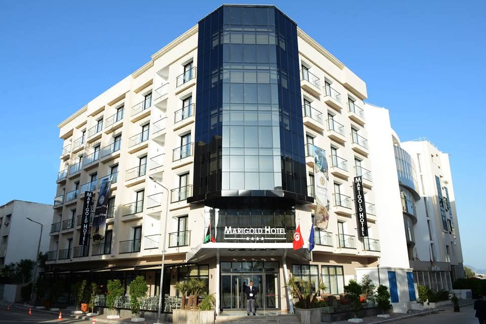 "a large building with a sign that reads "" hotel masséna "" prominently displayed on the front of the building" at Marigold Hotel