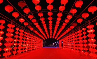 During the Chinese festival, the city is adorned with red and white lights at night at Xiaoguo Travellers' Home
