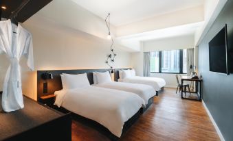 The bedroom features double beds, large windows, and a white bedspread on one side at Pentahotel Hong Kong, Tuen Mun