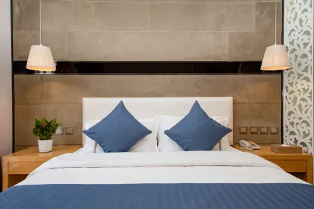 Mengzi Green Enjoy Hotel Отели рядом с достопримечательностью «Honghe College»