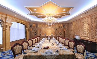 A spacious dining hall with long tables and chairs arranged for a group of 10 people at Tianyuan Hotel