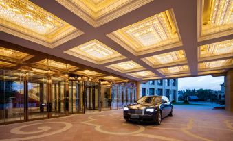 A spacious room with a beautifully decorated arched ceiling and side windows at Radisson Blu Forest Manor Shanghai Hongqiao