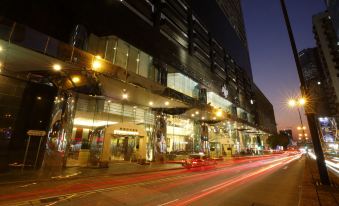 urban landscape with illuminated buildings and vehicles at B P International