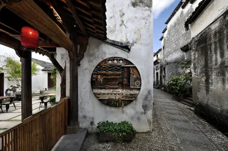 Sansheng Yizhai Hostel Отели рядом с достопримечательностью «Dipucun»