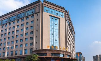 There is a large building with a visible exterior and a prominent name displayed in front at Celebrity City Hotel