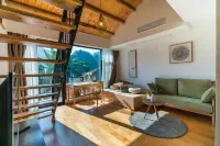 Xingyi Wanfeng Linyi Boutique Inn (Wanfenglin Baguatian Attractions) Отели в г. Синъи