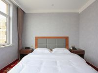 合兴居酒店(蓬莱国际机场店) - 温馨大床房