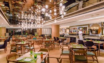 The restaurant's dining room is adorned with numerous hanging lights on each side at The Portman Ritz-Carlton, Shanghai