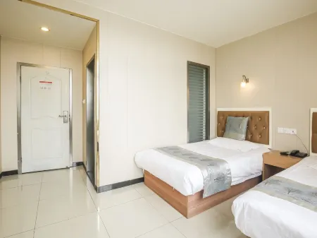 Jiujie Business Hotel Отели рядом с достопримечательностью «Jiuke Oasis Park»