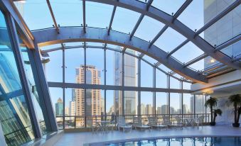 The interior of the hotel includes a spacious window and an indoor pool that offers views of other areas at City Hotel