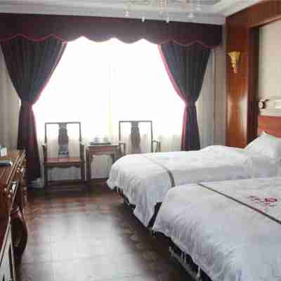 芒康綠野大酒店(芒康縣客運站店) Rooms